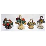 1122	4 CAST IRON FLOWER BASKET DOOR STOPS, LARGEST APPROXIMATELY 10 IN H