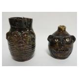 1165	STONEWARE FACE JUG, MARIE ROGERS AND STONEWARE FACE PITCHER, LARGGEST APPROXIMATELY 7 IN H