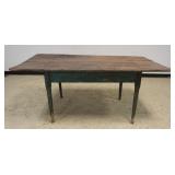 1217	PRIMITIVE FARM TABLE WITH TAPERED AND PIN CONSTRUCTED LEGS, OLD GREEN PAINT ON BASE, APPROXIMAT
