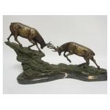 1003	CONTEMPORARY BRONZE OF STAGS BATTLING ON MARBLE BASE, LOSS TO ONE HORN, APPROXIMATELY 21 IN X 7