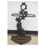 1174	ORNATE CAST IRON DOG UMBRELLA STAND W/FLORAL VINE DESIGN TOP, APPROXIMATELY 29 IN X 16 IN X 9 I