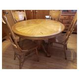 Round oak table with leaf & chairs