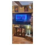 70" TV and lighted curio