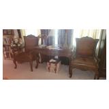 Leather seated arm chairs and stone inlay sofa table