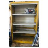 Cabinet with door rolled up.