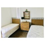 Two twin beds with wicker headboard