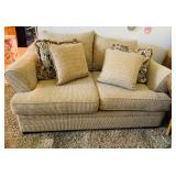 Loveseat with decorative pillows