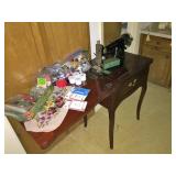 Vintage Singer sewing machine in original sewing cabinet