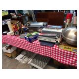 Marine grill and rail clamp.  Spiral binder with splines and covers.