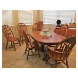 Heavy Oak table with one leaf and six chairs.