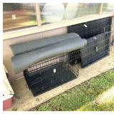Three large folding kennels with rubber floor mats.