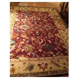 Large area rug never used - been in storage.  Great Colors