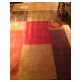 Large area rug.  Wonderful colors.  Warms any room.  Never used - been in storage
