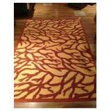 Outdoor / Indoor medium size area rug. Never used.  Great coral colors & style.