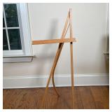 ART DISPLAY EASEL | With curved back leg; engraved with logo and "10/25 1987"; h. 45-1/2 x 18-1/4 x 
