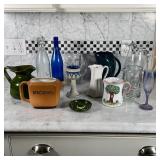 (12pc) LOT OF VESSELS | Group of various glass and pottery pitchers, cups, creamers, bottles, and sw