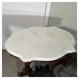 SERPENTINE MARBLE SIDE TABLE | Antique white marble top and four bowed legs which extend to a flat h