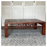 CHINESE LOW COFFEE TABLE | With oriental open work detail sides, parquetry table top; h. 13 x 39-1/4