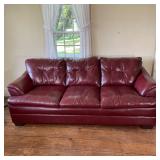 LARGE RED LEATHER SOFA | Three seater couch in red leather upholstery; h. 36 x w. 89 x d. 37 in. 