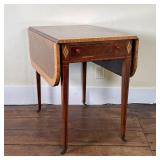 INLAID PEMBROKE TABLE | Drop sides, inlaid table with four tapering legs on casters, single drawer o