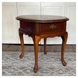 OVAL SIDE TABLE | Wood side table with oval top over a single drawer, four cabriole legs; h. 23 x 28