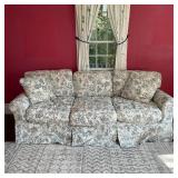 UPHOLSTERED SOFA | Three cushioned couch with deep seats, having a fabric cover with shabby chic sty