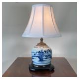 GINGER JAR LAMP | Chinoiserie blue and white pottery lamp with Chinese landscape designs, sitting on