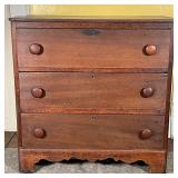 SMALL OAK CHEST OF DRAWERS | With three full-width drawers over a sculpted apron; h. 30-3/4 x w. 30-