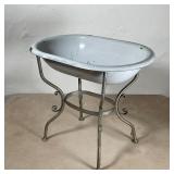 ENAMELED PORCELAIN BIRD BATH | White bird bath on a quadruped base with applied scrollwork; overall 