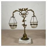 GLORY LAMP | Whale oil lamp, having two blown glass reservoirs suspended from a vine-form support on