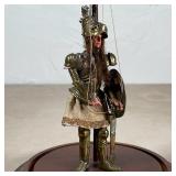 VINTAGE KNIGHT PUPPET | In a glass dome display case, a painted wooden stringed puppet of a knight w