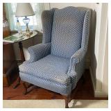 QUEEN ANNE STYLE WING CHAIR | Over cabriole legs with pad feet, having blue upholstery with arrowhea