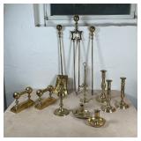 LARGE GROUP BRASS ITEMS | Including push-up candlesticks, two lamp bases, plus fireplace equipment, 