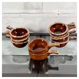 (7pc) SET HULL SLIPWARE BOWLS | Hull ovenproof slipware bowls with handles, having speckled rims (w.