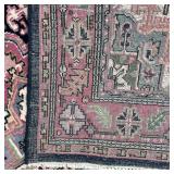 GEOMETRIC MEDALLION RUG | Pink medallion on a blue ground with a salmon border with rosettes and lea