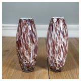 PAIR ART GLASS VASES | A pair of vases with a milk glass interior and an iridescent spotted purple d