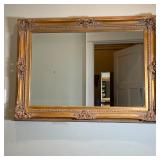 GILT FRAME MIRROR | Having a gilt scroll frame with beveled glass mirror insert, in excellent condit