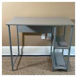 GRAY COMPUTER TABLE | Gray laminate desk with open shelves, of nice small size and appearing in over