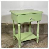 GREEN PAINTED STAND | Having a singled drawer and a lower shelf; h. 25 x w. 20 x d. 15 in. 