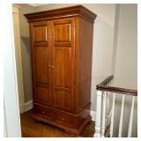 SOLID WOOD ARMOIRE | Two cabinet doors revealing inner shelving with hole in back / removable panel 