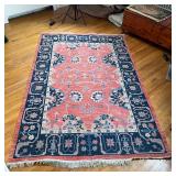 CHINESE STYLE FLAT WOVEN RUG | Area carpet with salmon ground, having a central medallion with flora