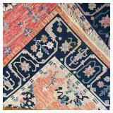 CHINESE STYLE FLAT WOVEN RUG | Area carpet with salmon ground, having a central medallion with flora