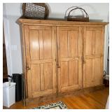 COUNTRY PINE TRIPLE CABINET | Armoire with three cabinet doors; h. 69-1/2 x w. 79 x d. 21 in. 