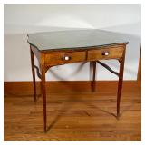 FRENCH STYLE SIDE TABLE | With a conforming glass top, having two drawers with porcelain pulls over 