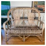 RATAN BENCH | Two seater bench with rattan back and scrolled arms; h. 39-1/4 x w. 48-1/4 x d. 23 in.