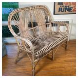 RATAN BENCH | Two seater bench with rattan back and scrolled arms; h. 39-1/4 x w. 48-1/4 x d. 23 in.