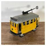 PAINTED TIN TROLLEY CAR | "OLINDA-FAROL" yellow painted tin trolley car; car h. 7-1/2 x w. 5 x l. 12