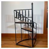 WROUGHT IRON LIBRARY STAIRS | Spiral library stairs, having three wood steps in a black wrought iron