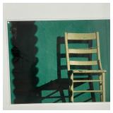 "Silla Blanca" showing a chair against a blue wall