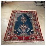 PERSIAN PRAYER RUG | 20th century, wool area carpet, having a blue field over light blue reserves